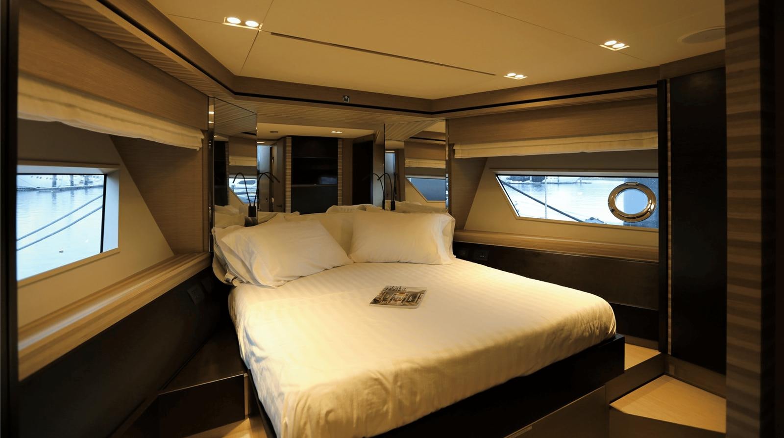 a bed in a room aboard 2020 FERRETTI 670 Yacht for Sale