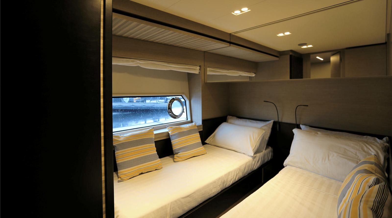 a room with a bed and a window aboard 2020 FERRETTI 670 Yacht for Sale