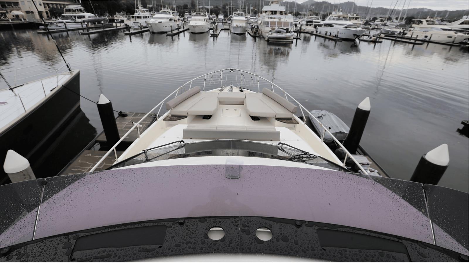 a boat in a harbor aboard 2020 FERRETTI 670 Yacht for Sale