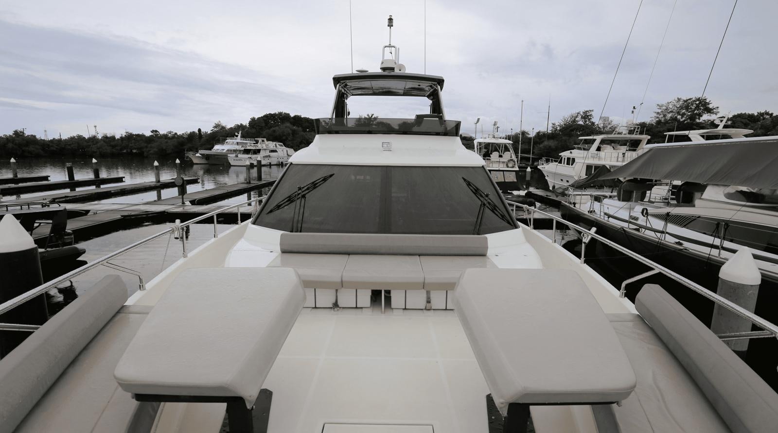 a boat docked at a pier aboard 2020 FERRETTI 670 Yacht for Sale