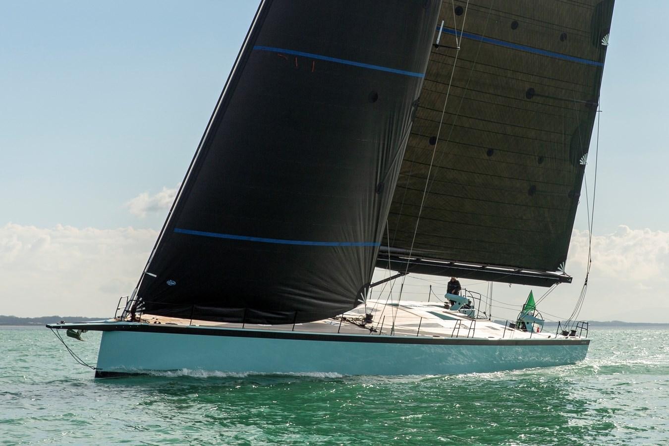 a sailboat in the ocean aboard MOMI Yacht for Sale