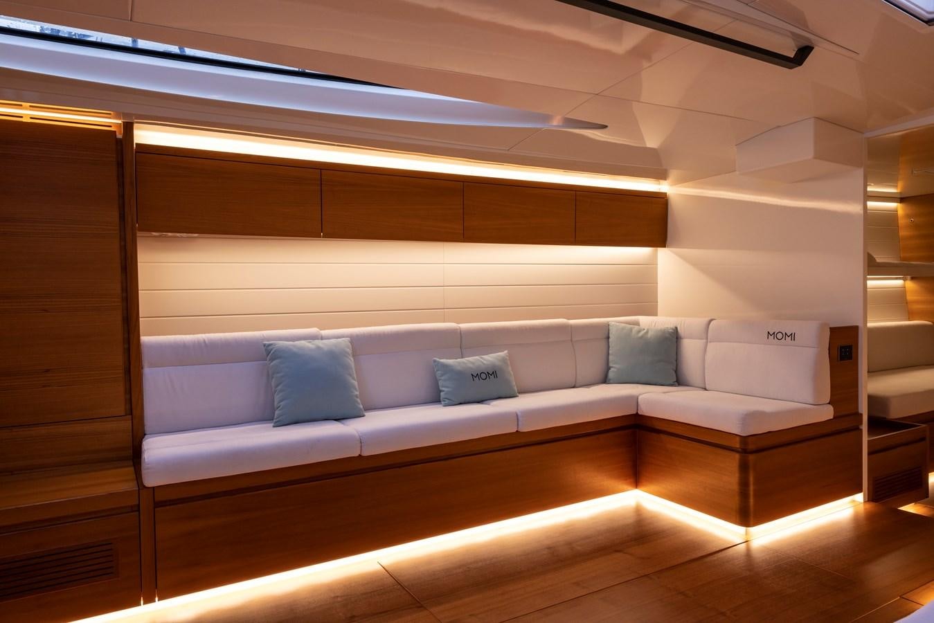 a couch in a room aboard MOMI Yacht for Sale