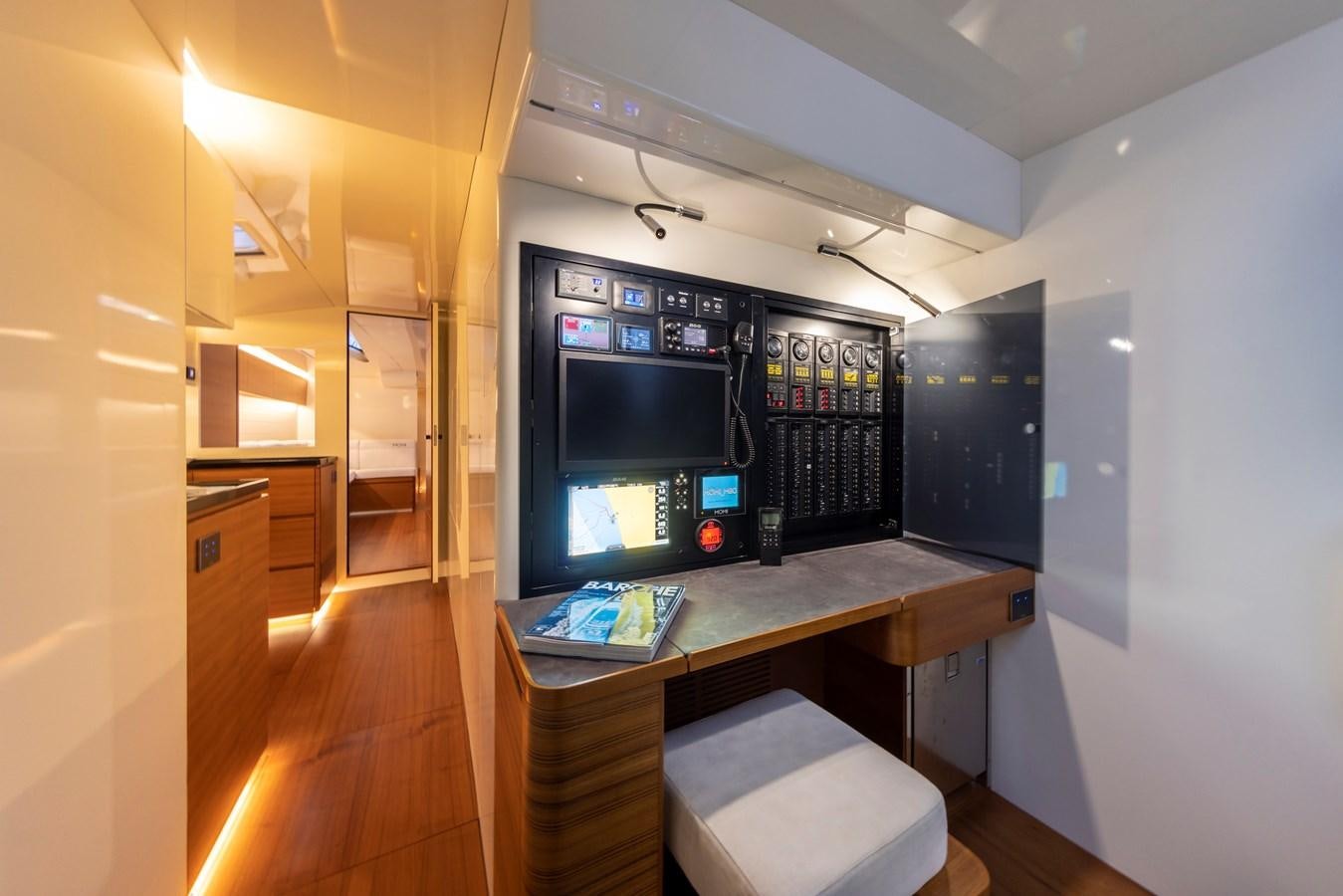 a room with a desk and a tv aboard MOMI Yacht for Sale