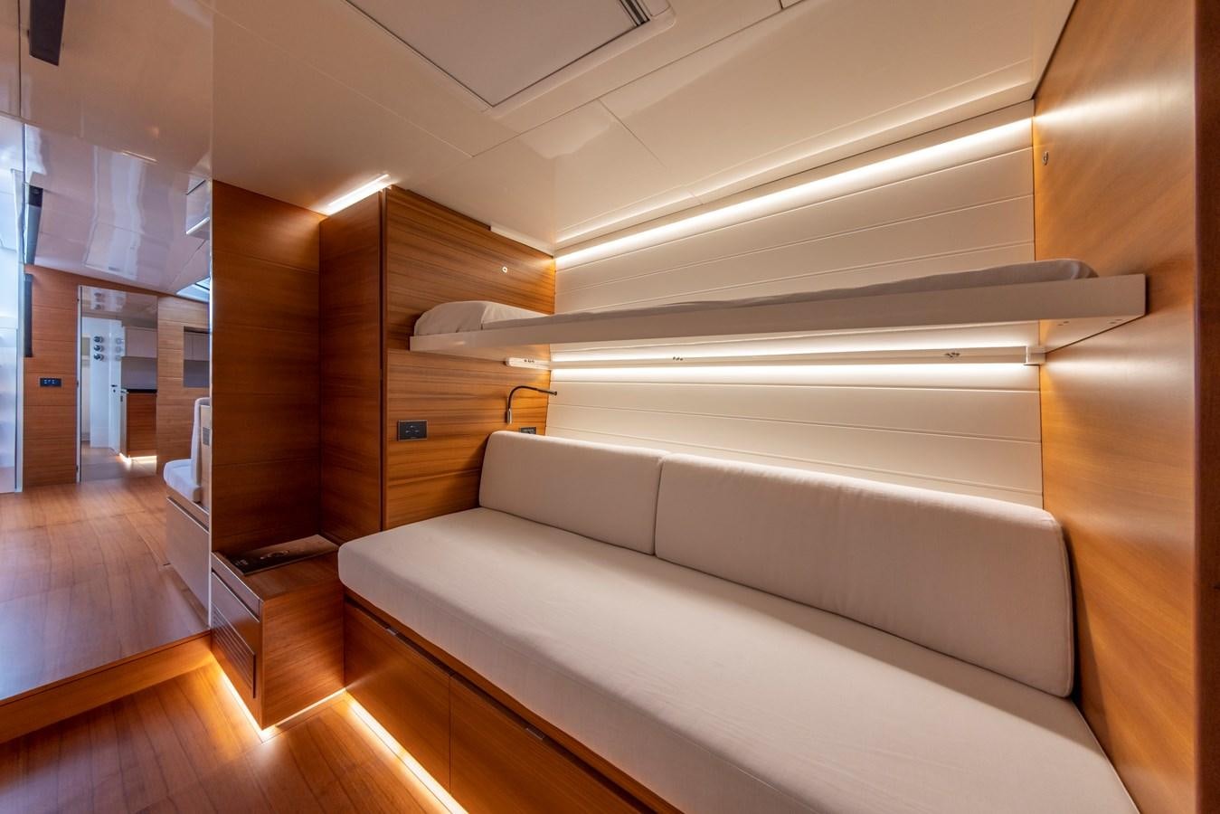a room with a bed and a desk aboard MOMI Yacht for Sale