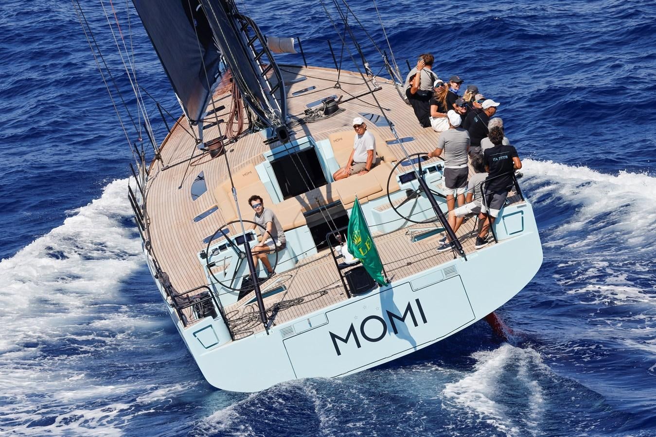 a group of people on a boat aboard MOMI Yacht for Sale