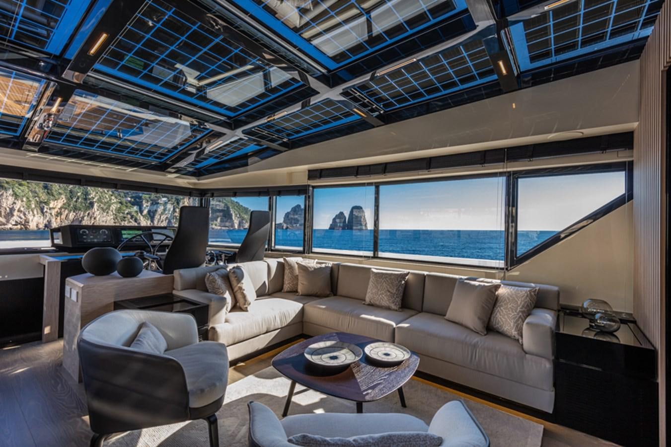 a living room with a large window aboard ARCADIA SHERPA 80 Yacht for Sale