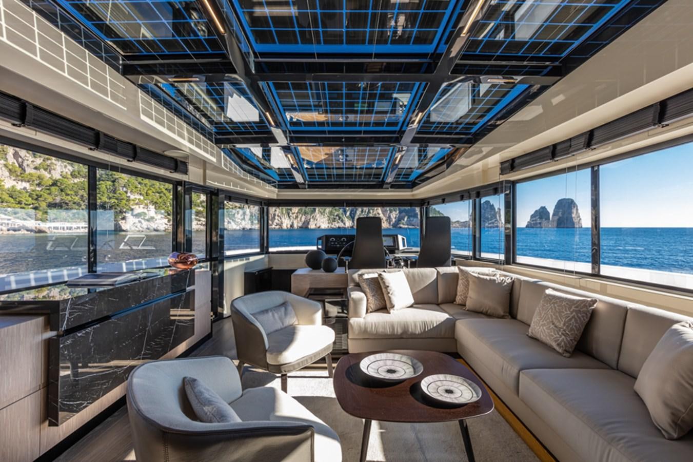 a living room with a large window aboard ARCADIA SHERPA 80 Yacht for Sale
