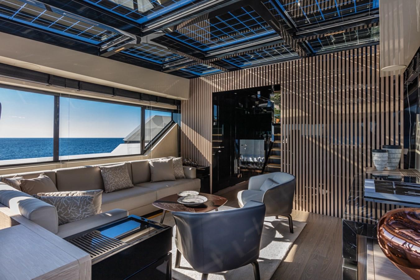 a living room with a large window aboard ARCADIA SHERPA 80 Yacht for Sale
