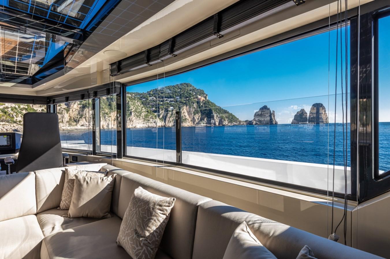 a large window overlooking a body of water aboard ARCADIA SHERPA 80 Yacht for Sale