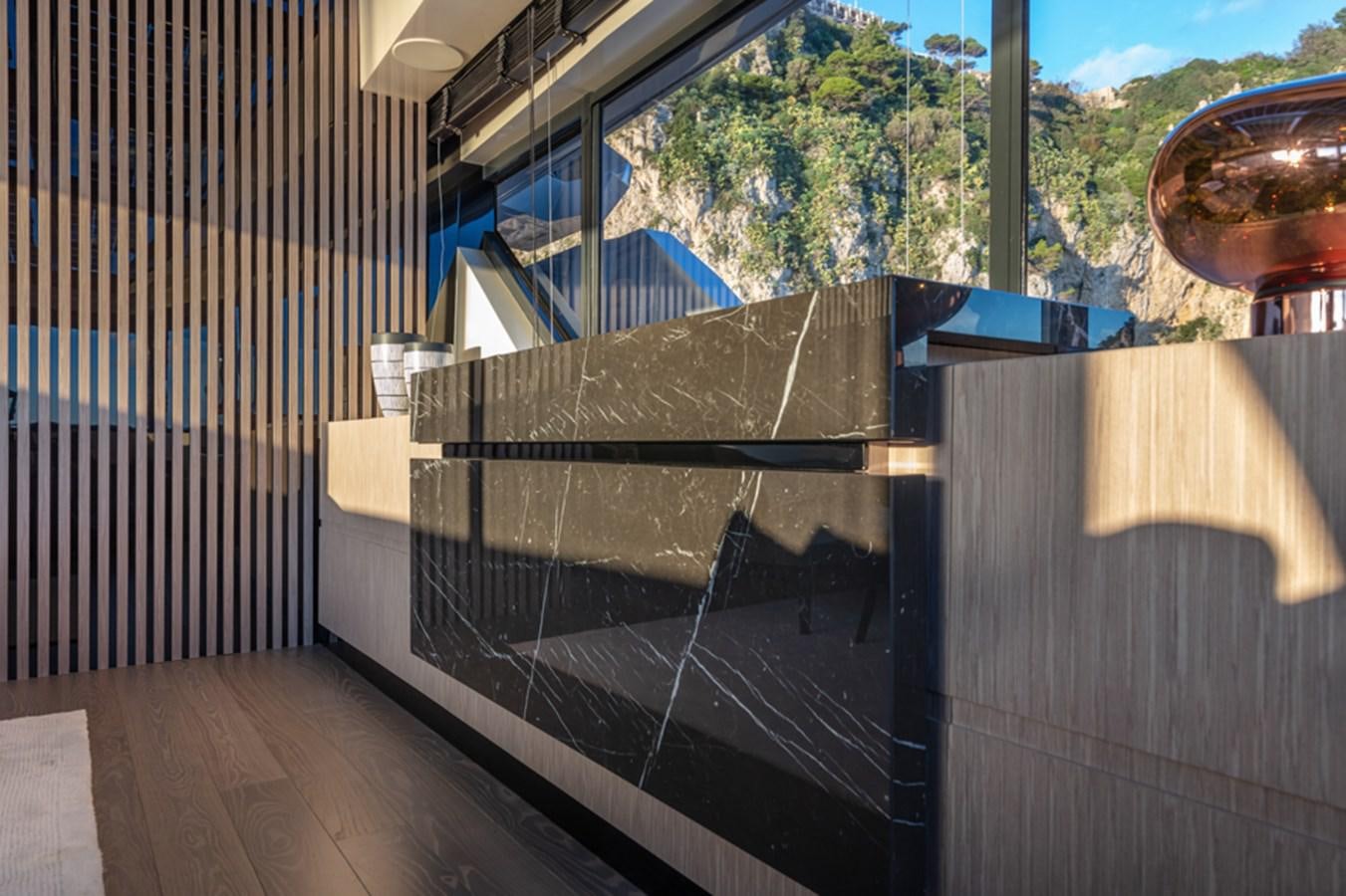 a large wooden box on a table aboard ARCADIA SHERPA 80 Yacht for Sale