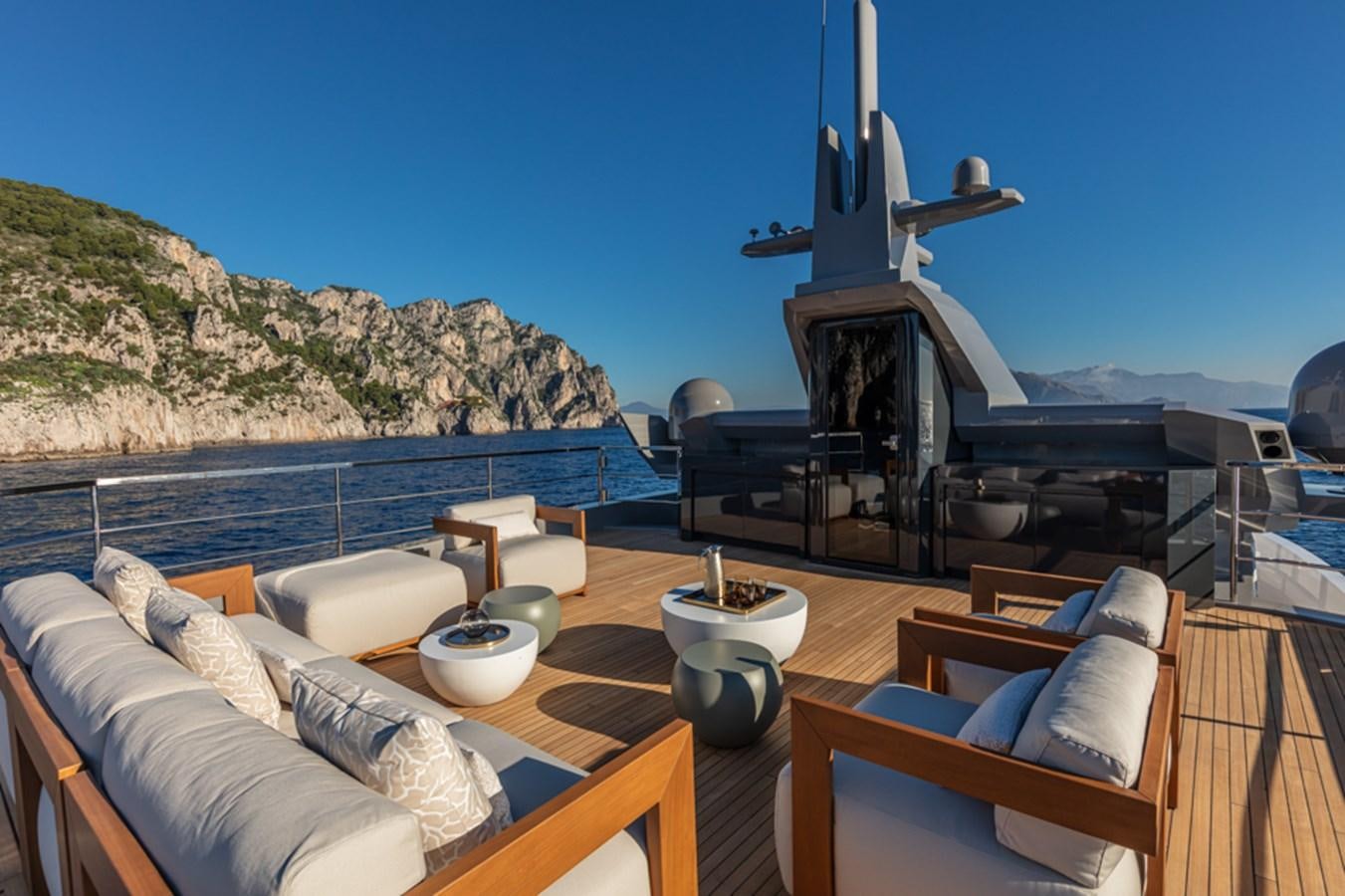 a balcony with a view of the ocean and a large telescope aboard ARCADIA SHERPA 80 Yacht for Sale