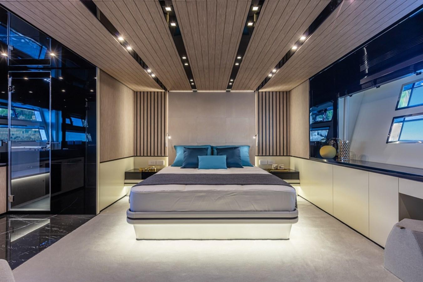 a room with a bed and a couch aboard ARCADIA SHERPA 80 Yacht for Sale