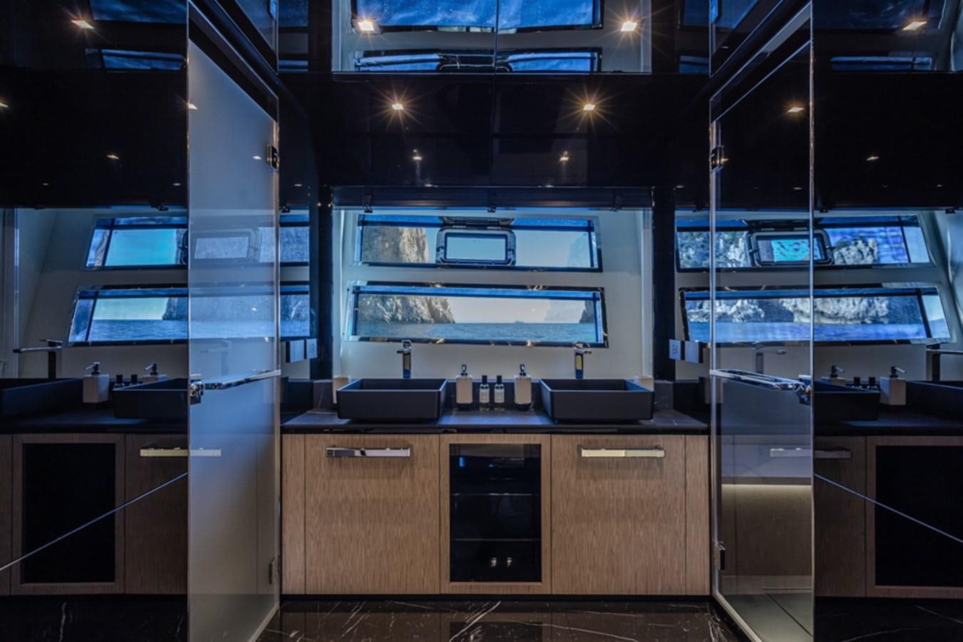 a kitchen with a stove and cabinets aboard ARCADIA SHERPA 80 Yacht for Sale