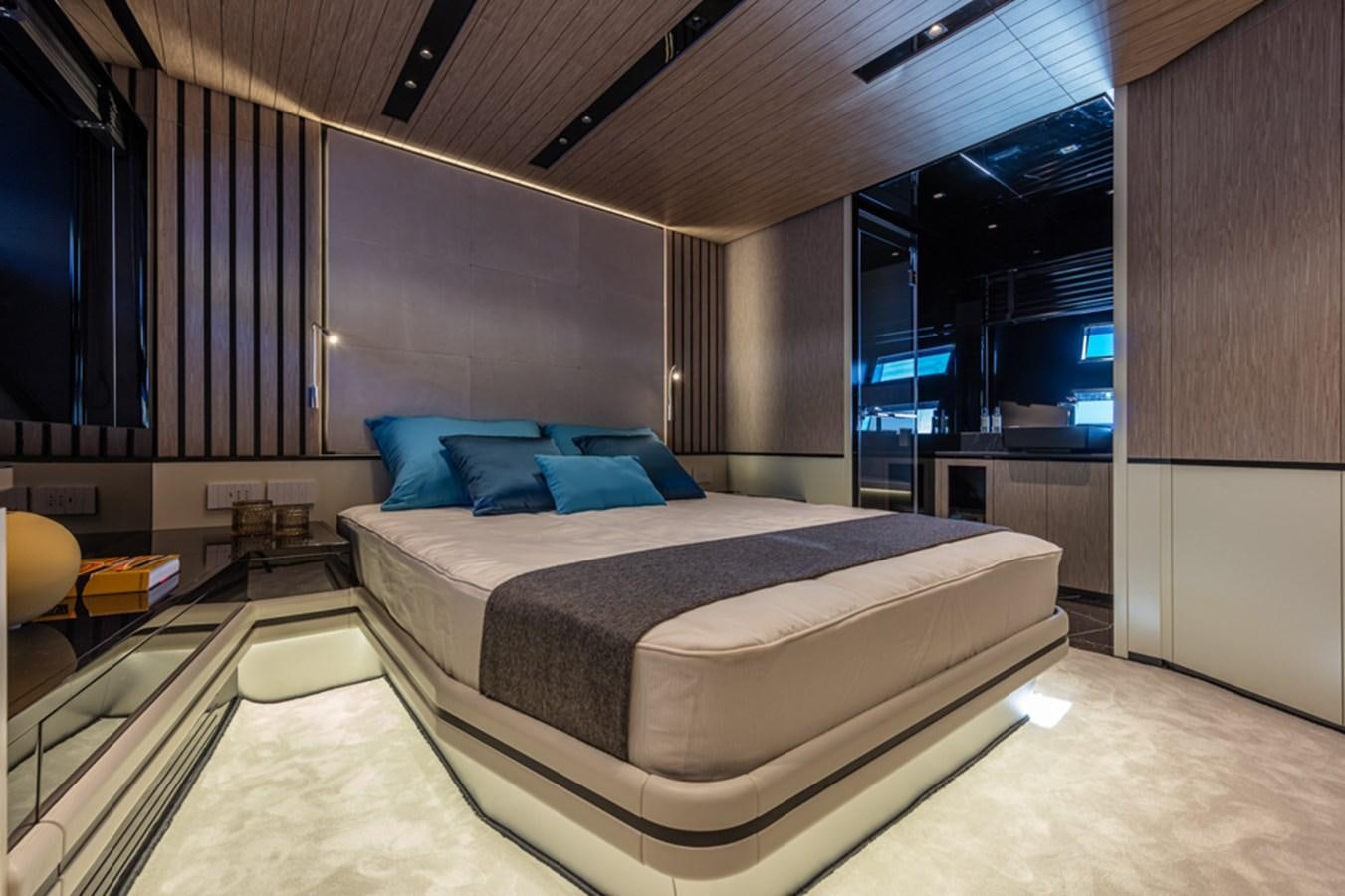 a large bedroom with a large bed aboard ARCADIA SHERPA 80 Yacht for Sale