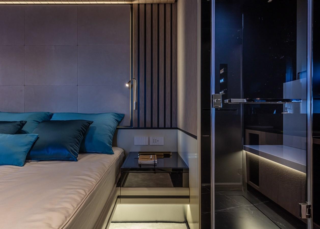 a room with a bed and a door aboard ARCADIA SHERPA 80 Yacht for Sale