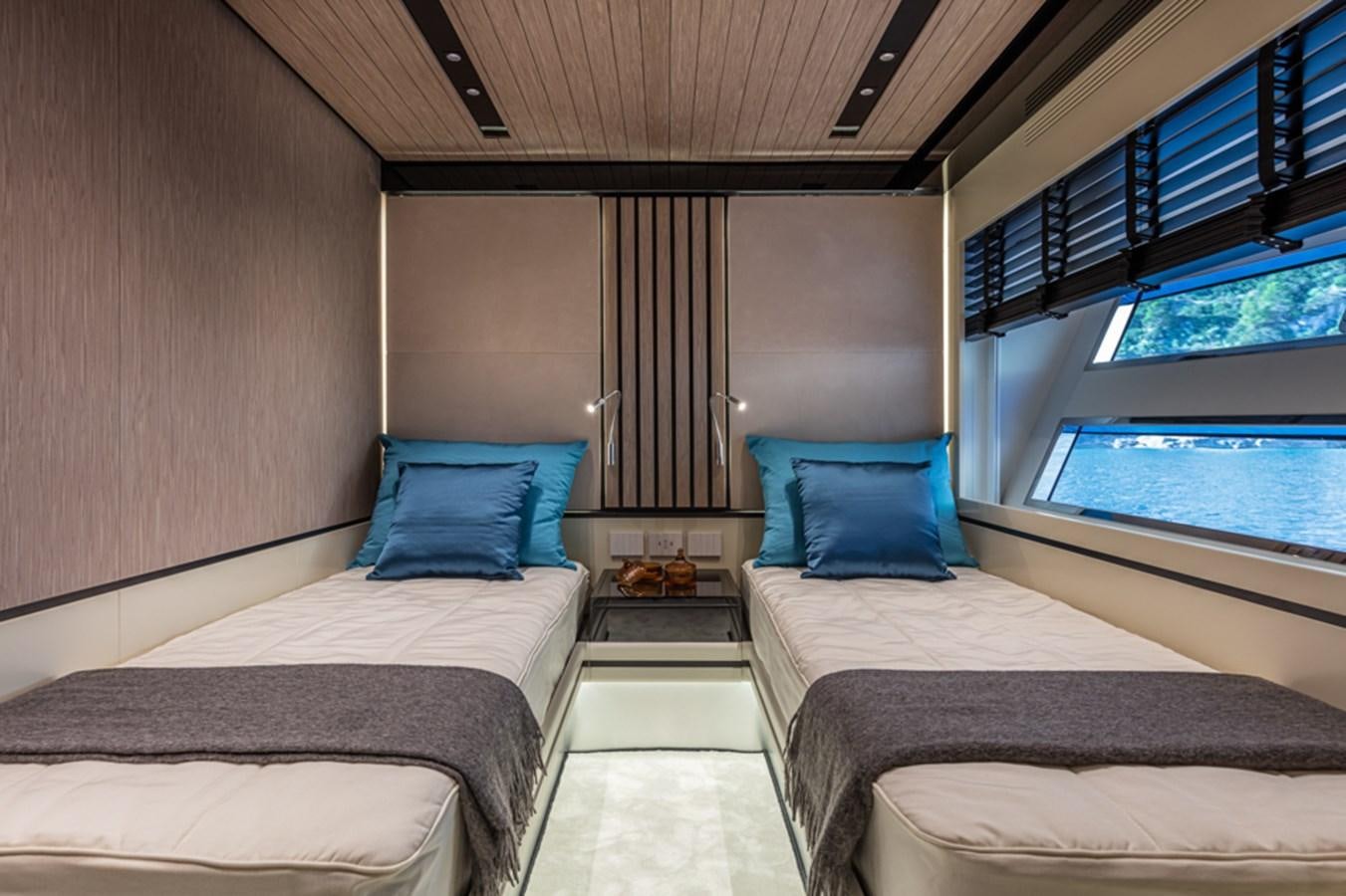 a room with two beds aboard ARCADIA SHERPA 80 Yacht for Sale