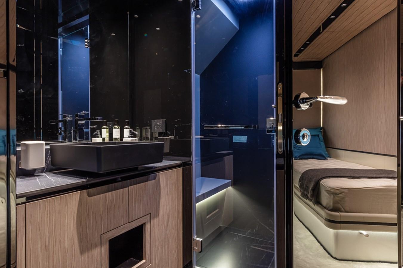 a bathroom with a sink and a mirror aboard ARCADIA SHERPA 80 Yacht for Sale