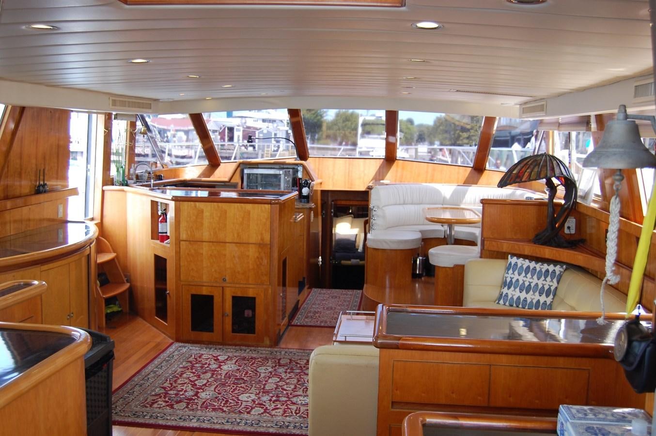 a room with a desk and a bed aboard SOTITO Yacht for Sale