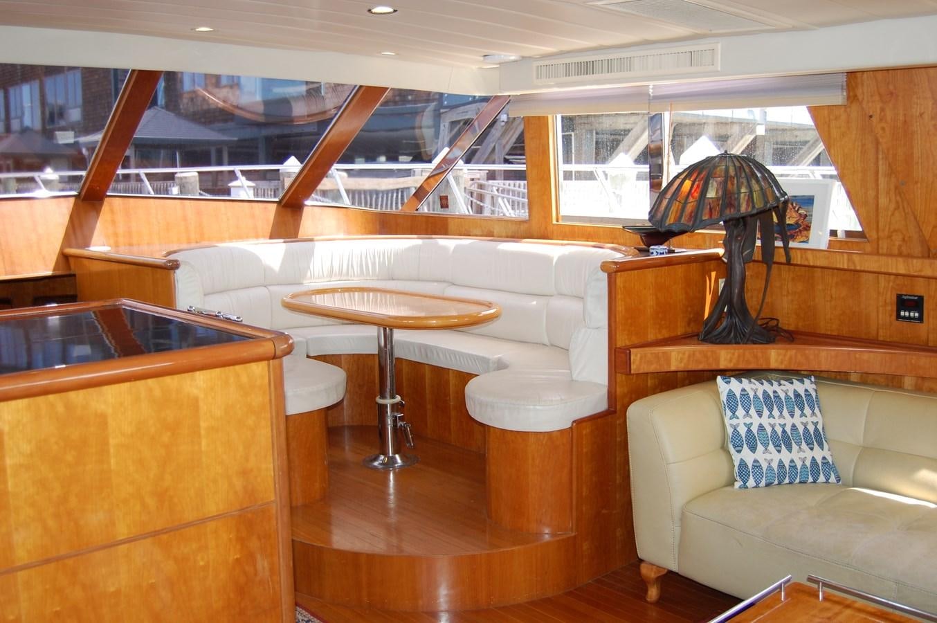 a room with a couch and a table aboard SOTITO Yacht for Sale
