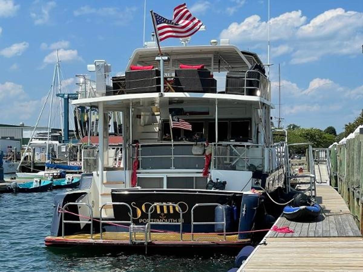 a boat docked at a pier aboard SOTITO Yacht for Sale