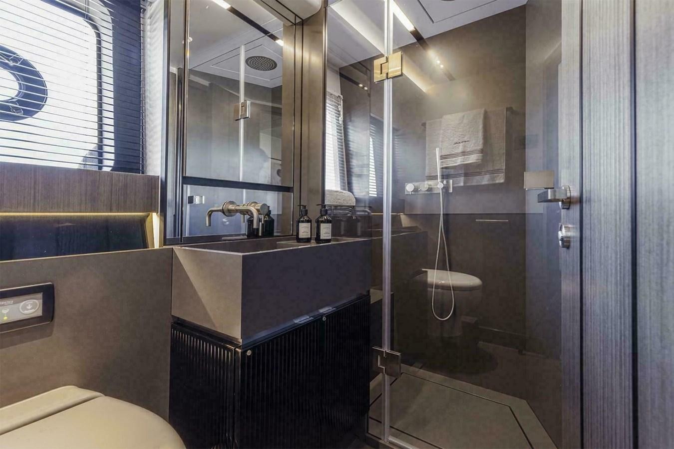 a bathroom with a glass shower aboard PEARL 72 INDULGENCE Yacht for Sale