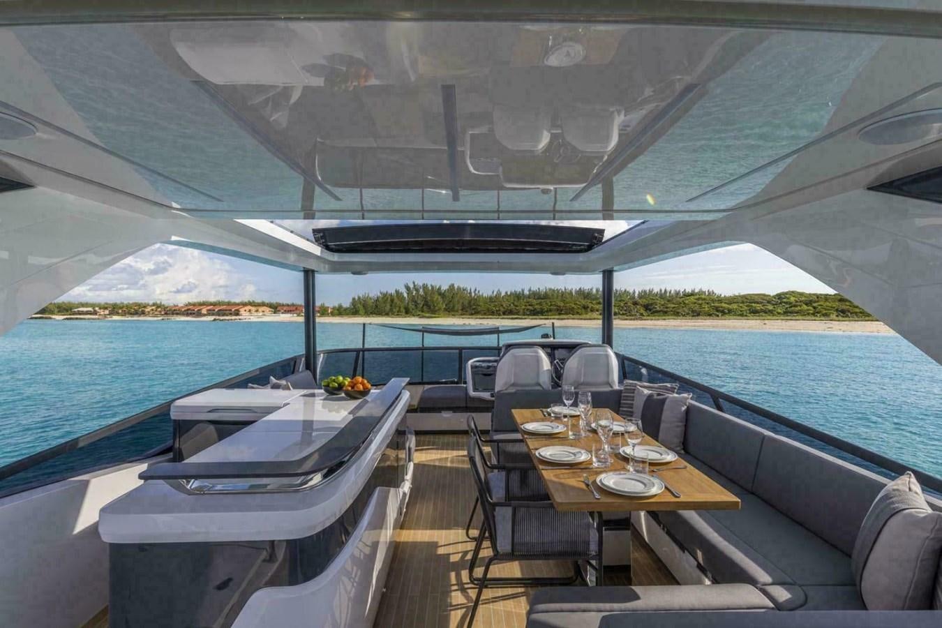 a table and chairs on a boat aboard PEARL 72 INDULGENCE Yacht for Sale