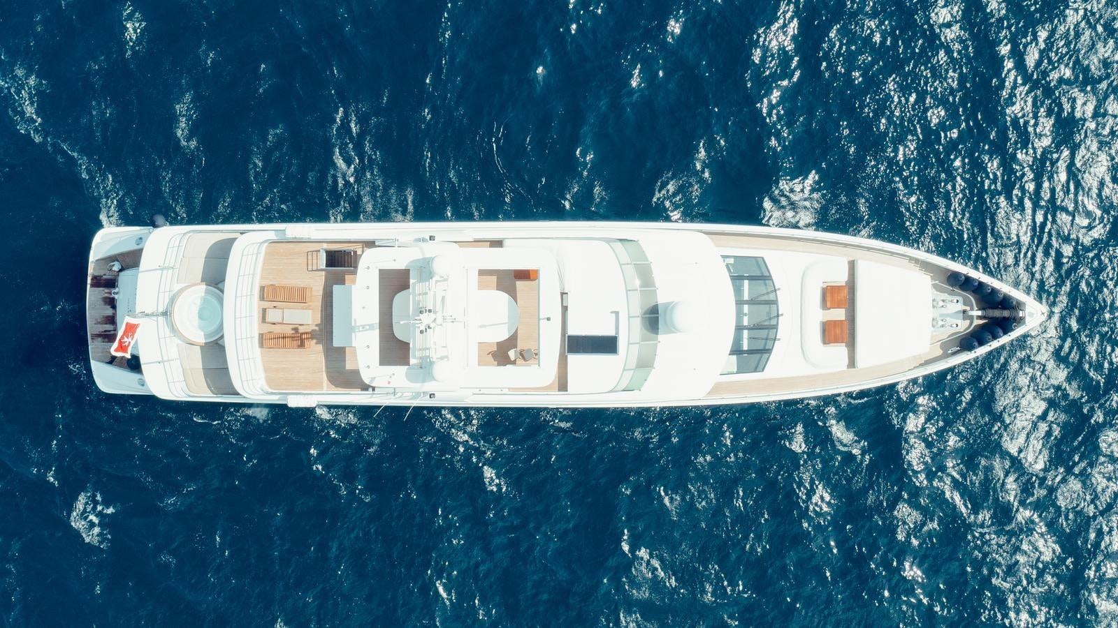 a white car with a number on it in the snow aboard TATIANA I Yacht for Sale