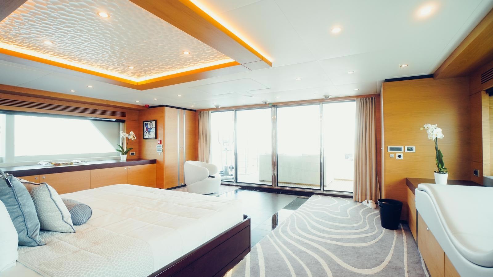 a bedroom with a large bed aboard TATIANA I Yacht for Sale