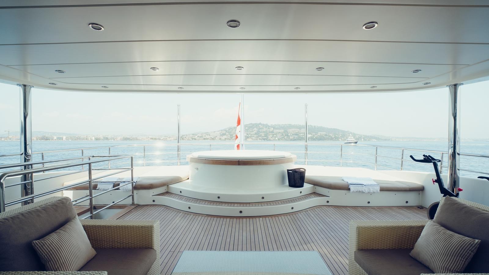 a large white boat on a deck aboard TATIANA I Yacht for Sale