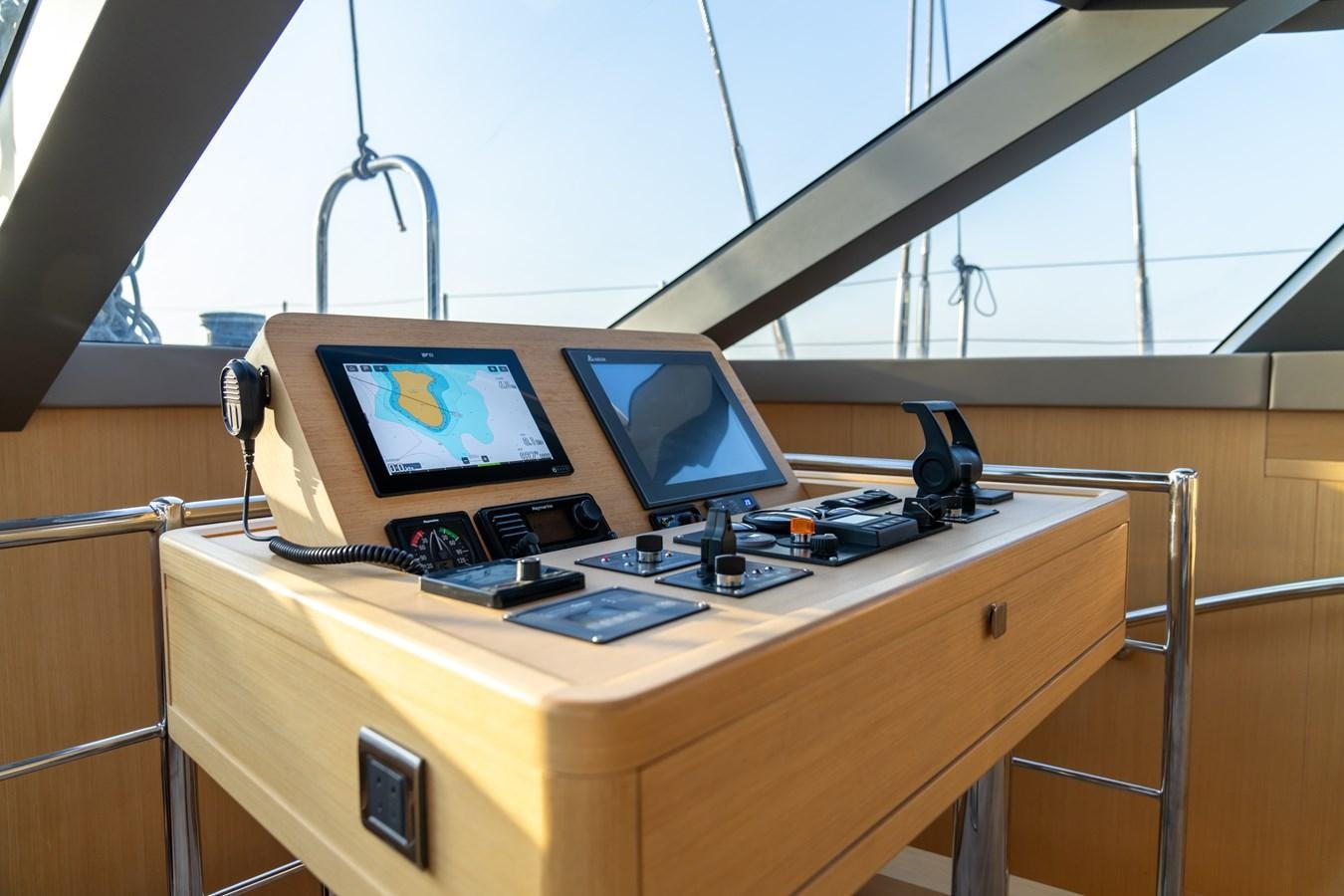 a desk with a laptop and a monitor on it aboard JASMINA III Yacht for Sale