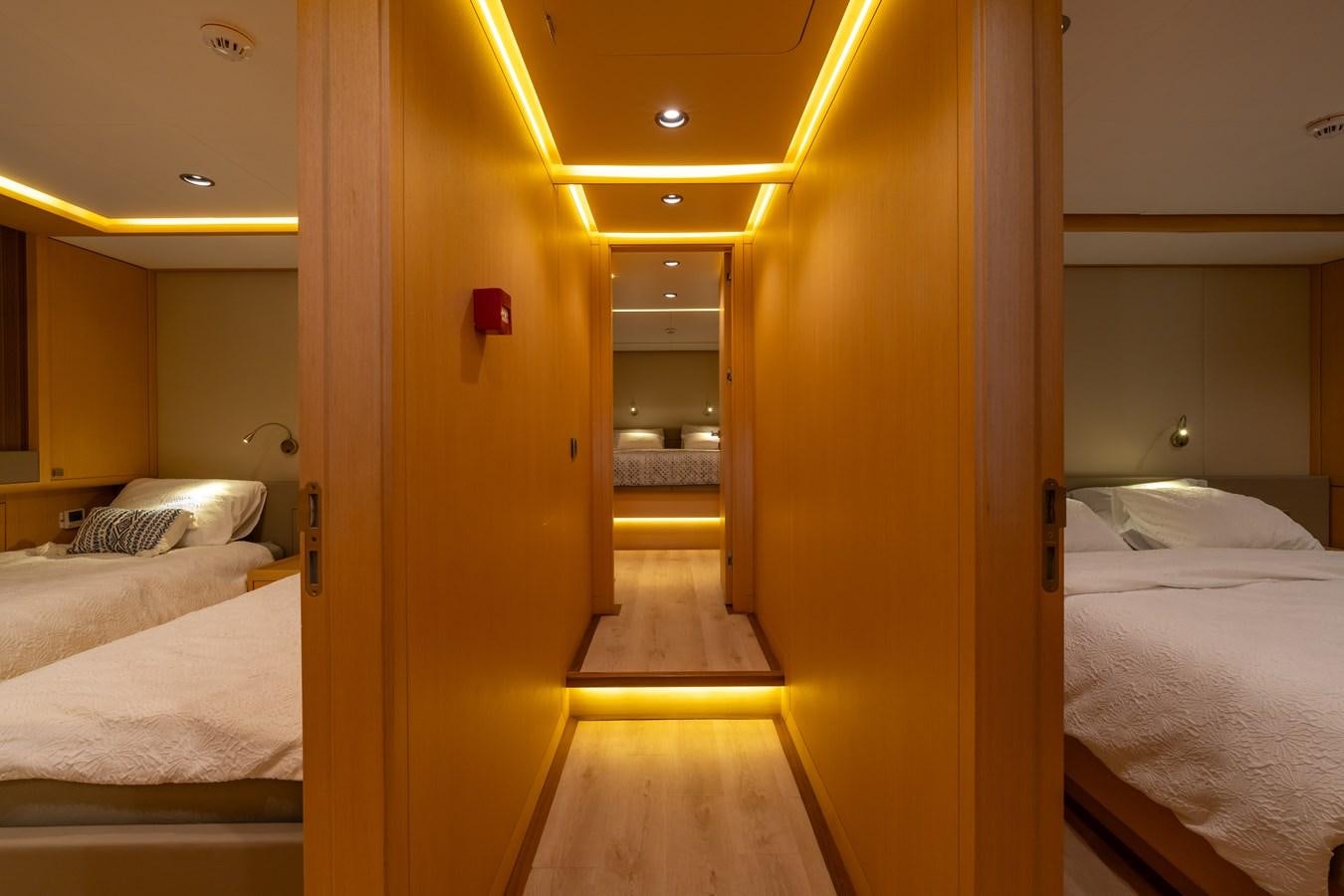 a room with a couple of beds aboard JASMINA III Yacht for Sale