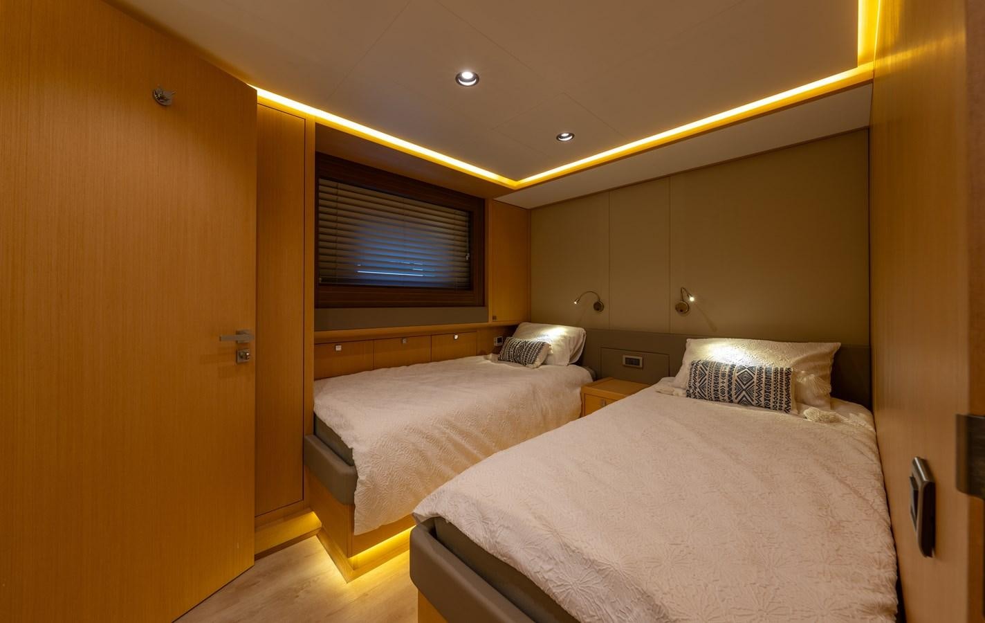 a room with two beds aboard JASMINA III Yacht for Sale