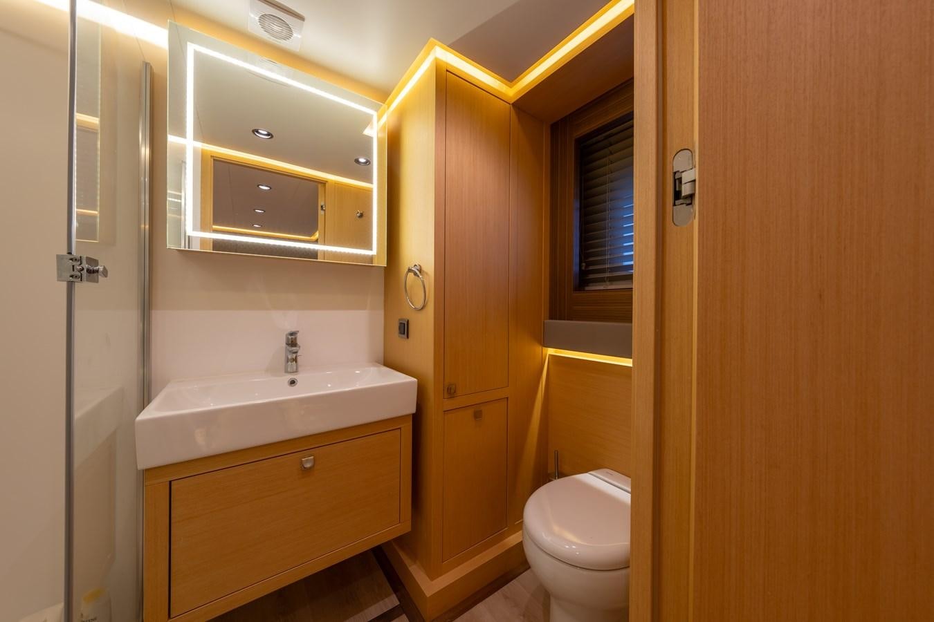 a bathroom with a sink and toilet aboard JASMINA III Yacht for Sale