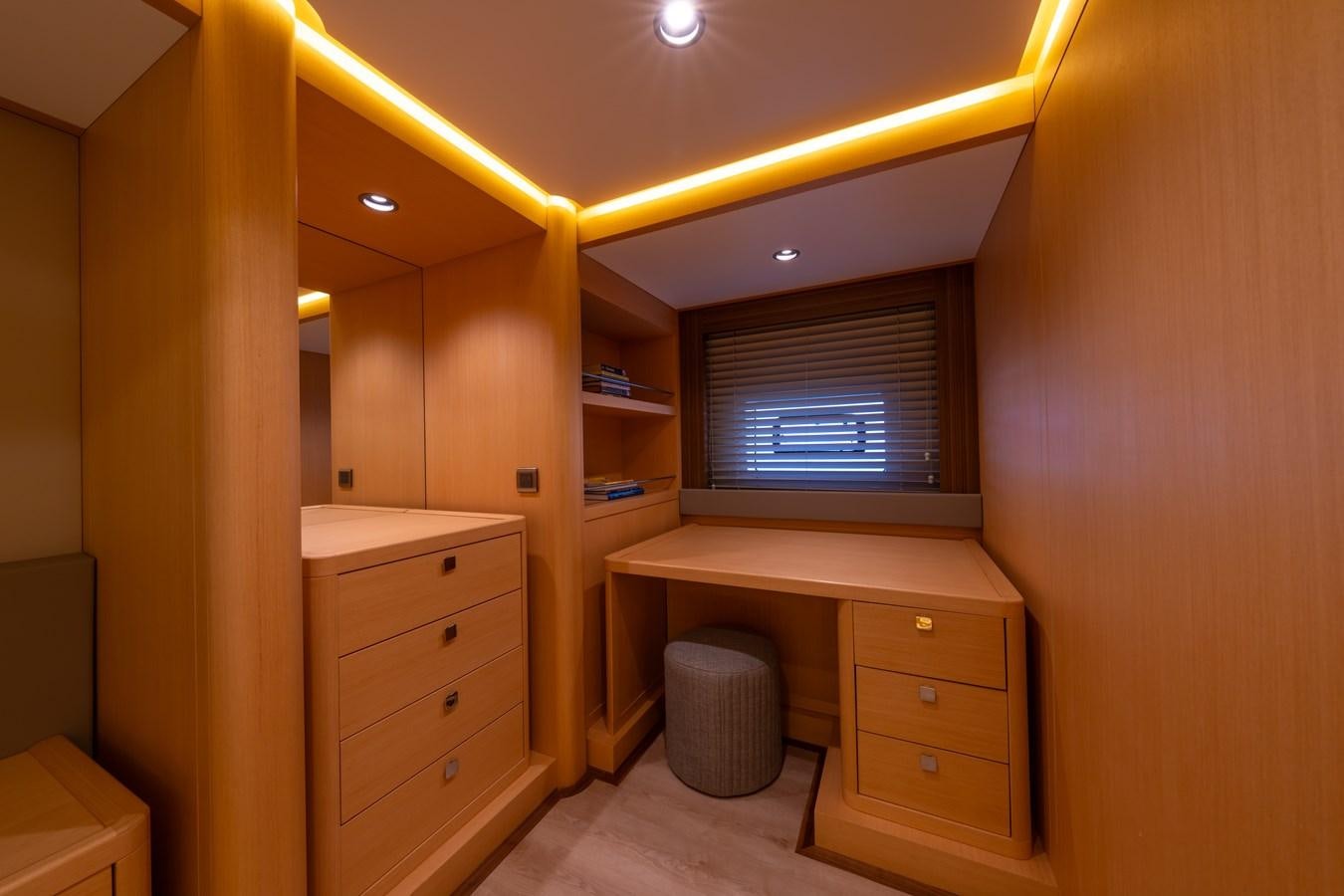 a room with a desk and a window aboard JASMINA III Yacht for Sale