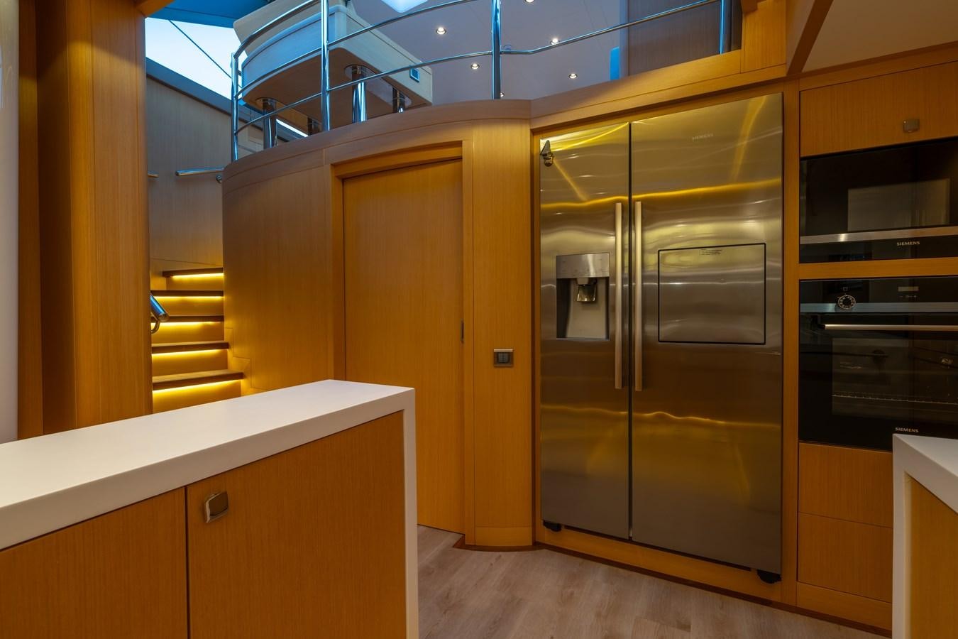 a kitchen with a large glass door aboard JASMINA III Yacht for Sale