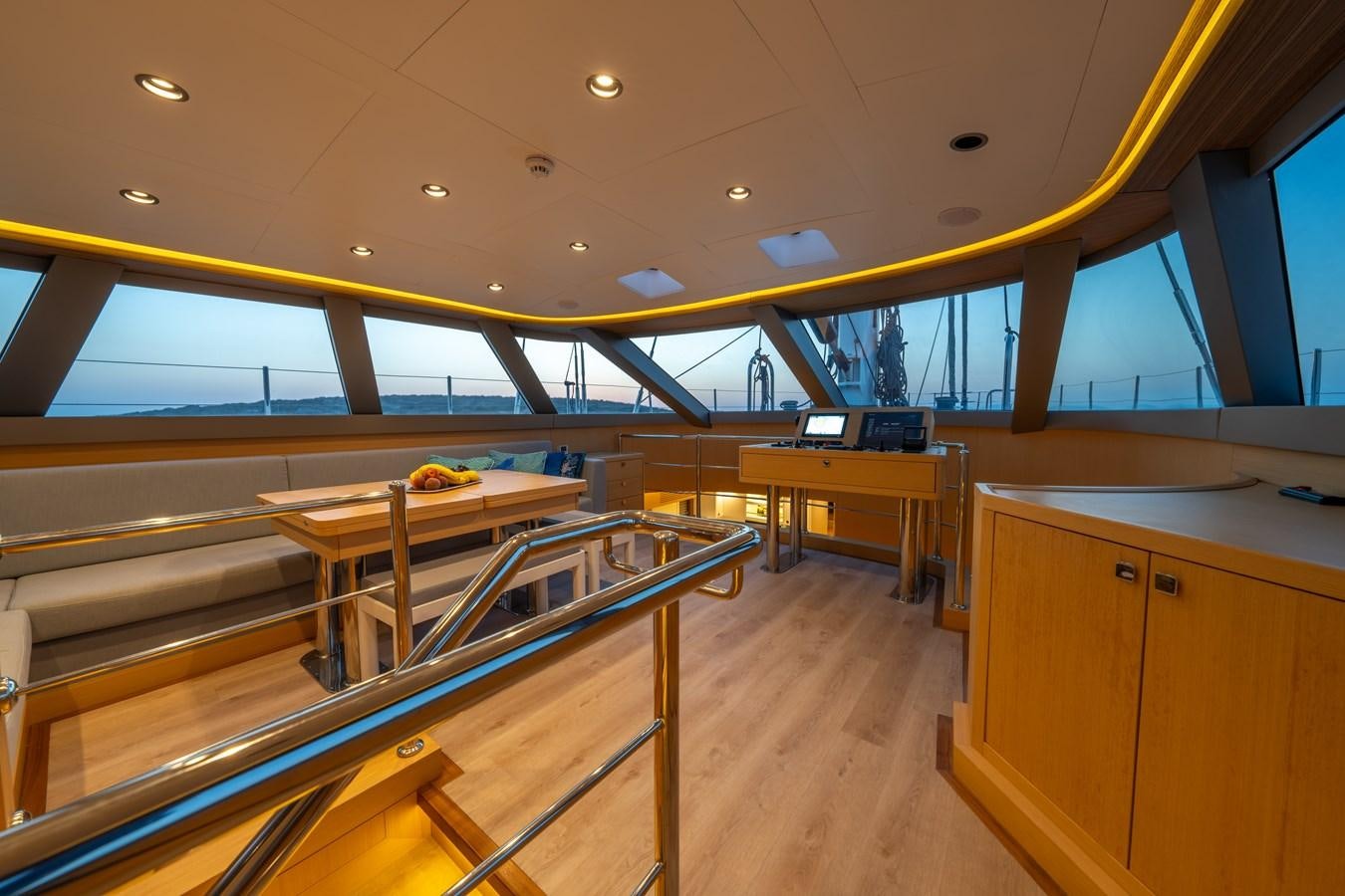 a room with tables and chairs aboard JASMINA III Yacht for Sale