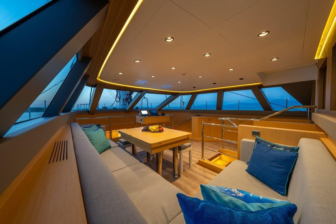 a room with a couch and a table aboard JASMINA III Yacht for Sale