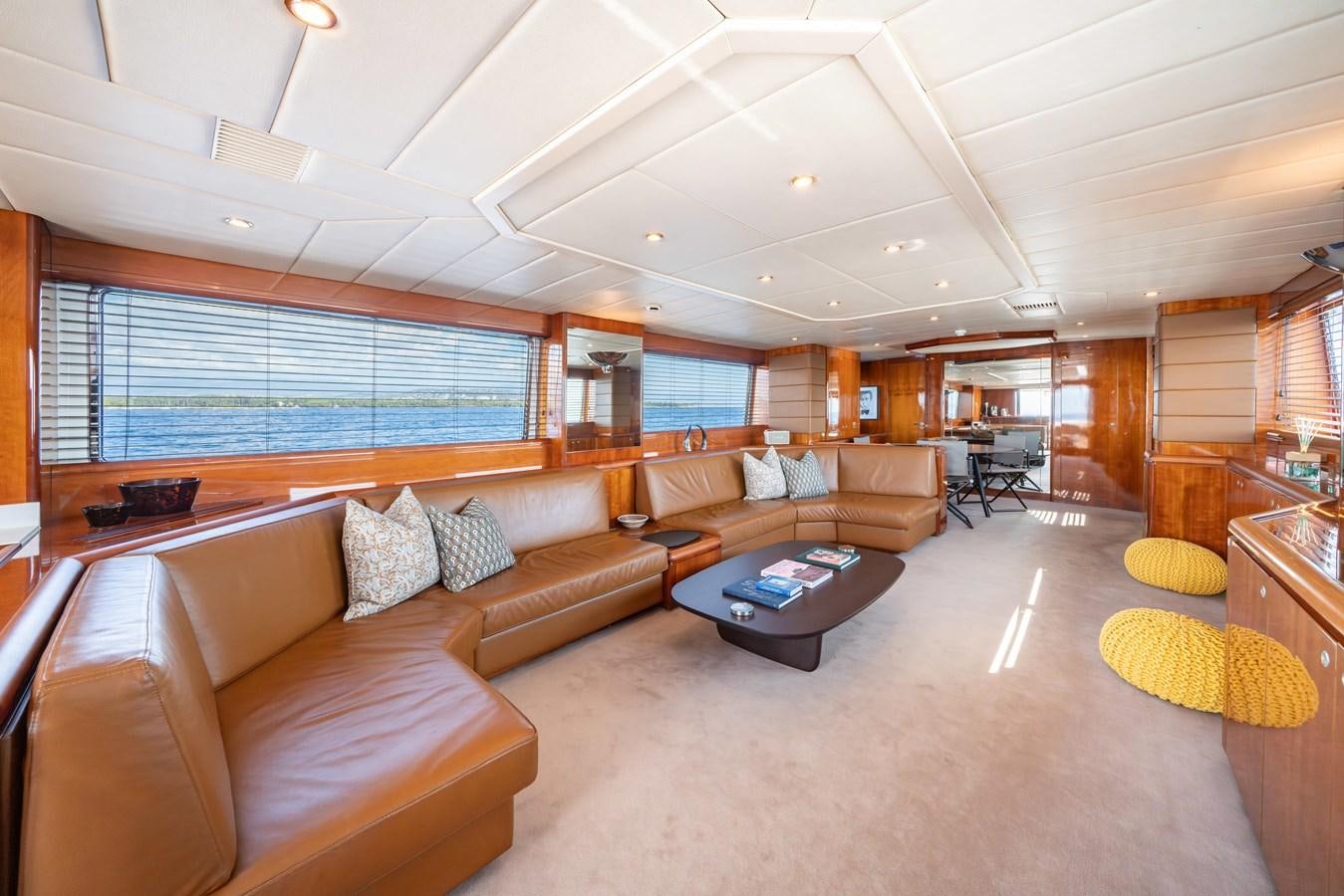 a living room with a couch and a table aboard MOONRAKER II Yacht for Sale