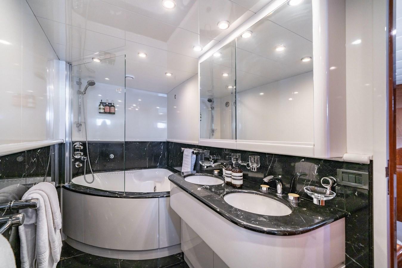 a bathroom with a large mirror aboard MOONRAKER II Yacht for Sale