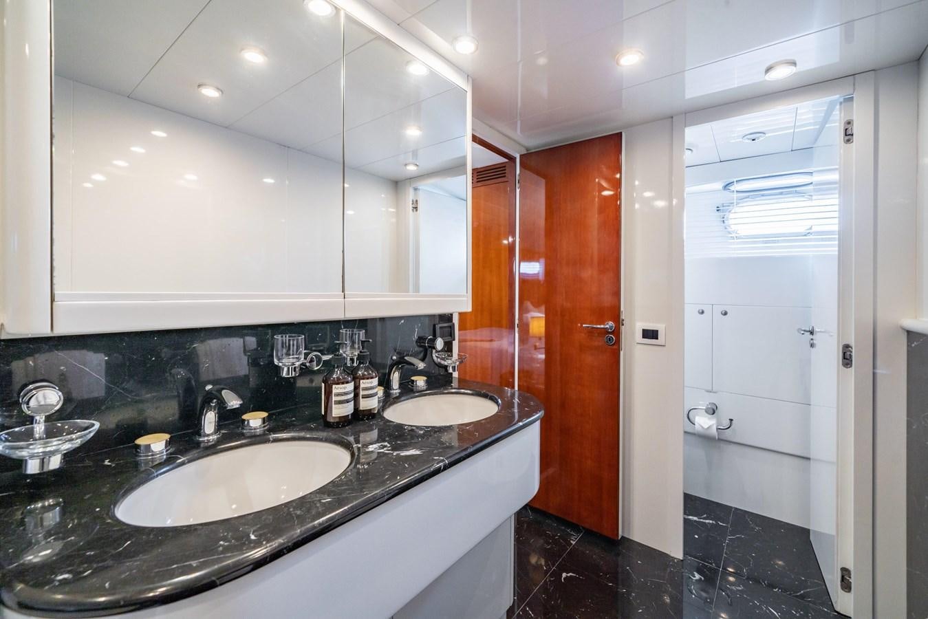 a bathroom with a sink and a mirror aboard MOONRAKER II Yacht for Sale