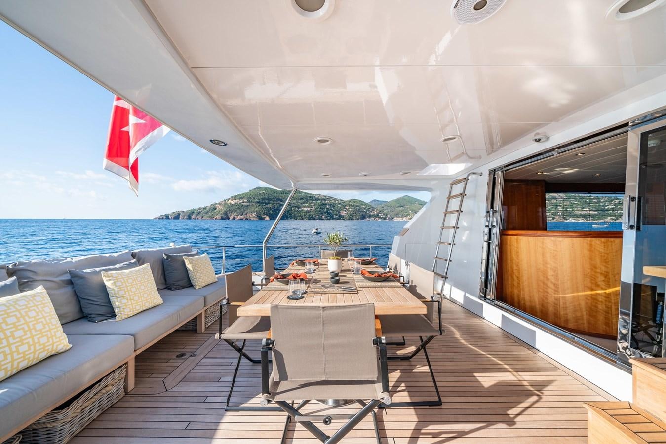 a boat with a table and chairs aboard MOONRAKER II Yacht for Sale