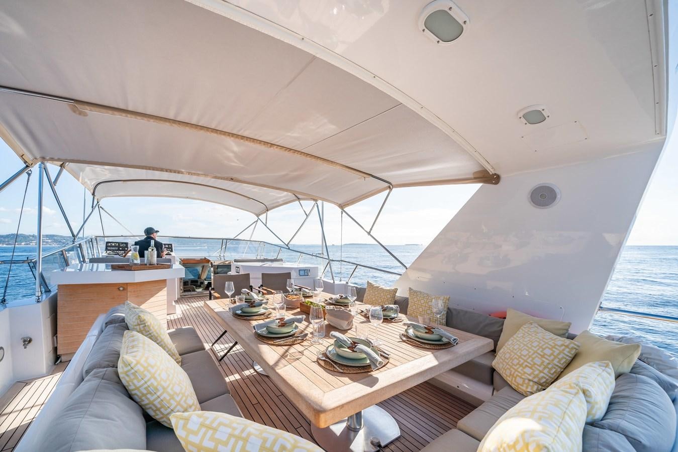 a boat with a table and chairs aboard MOONRAKER II Yacht for Sale