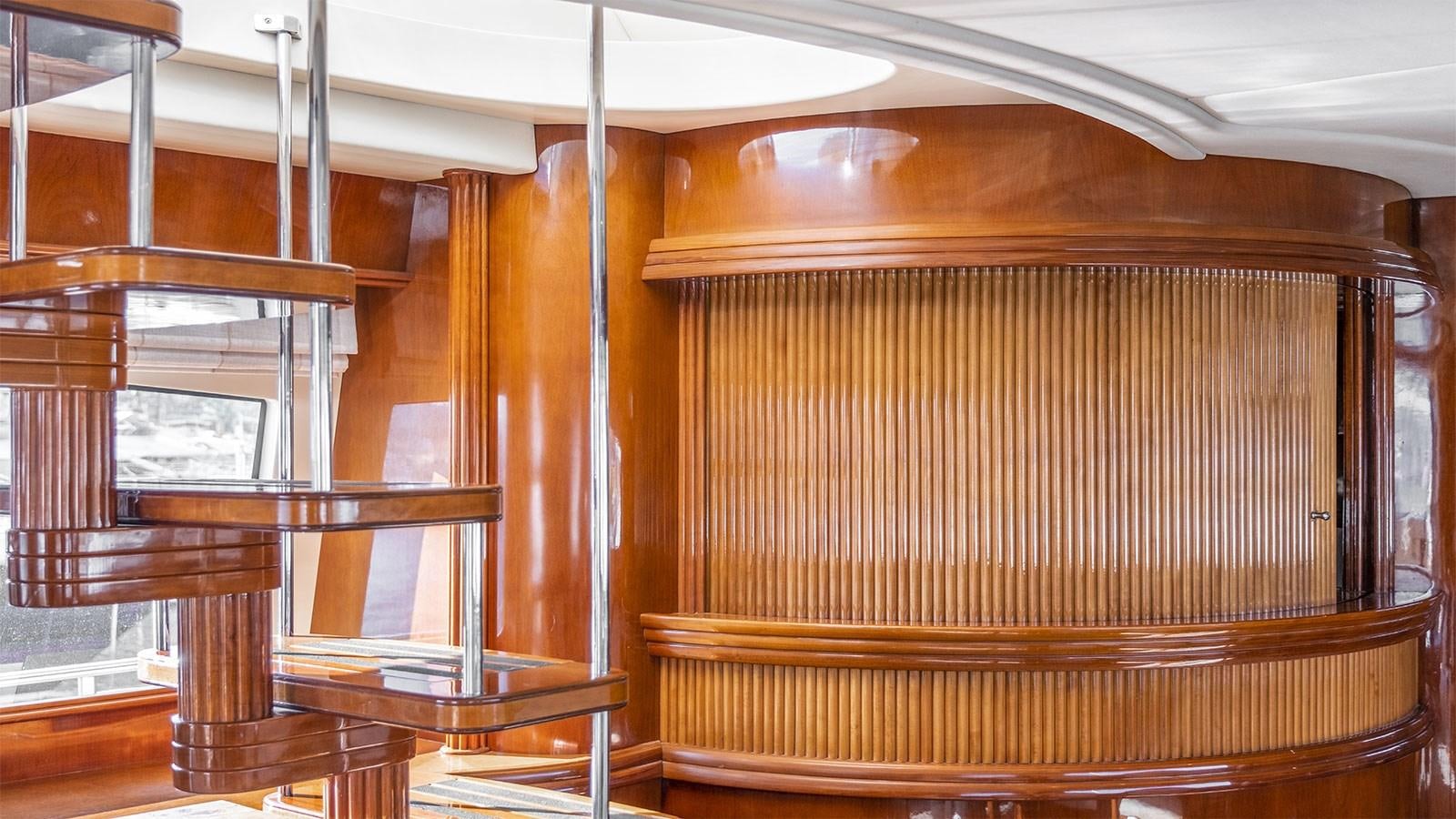 a wooden room with a wood wall aboard TITAN Yacht for Sale