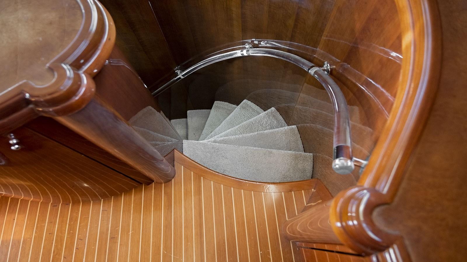 a roll of toilet paper on a wooden table aboard TITAN Yacht for Sale
