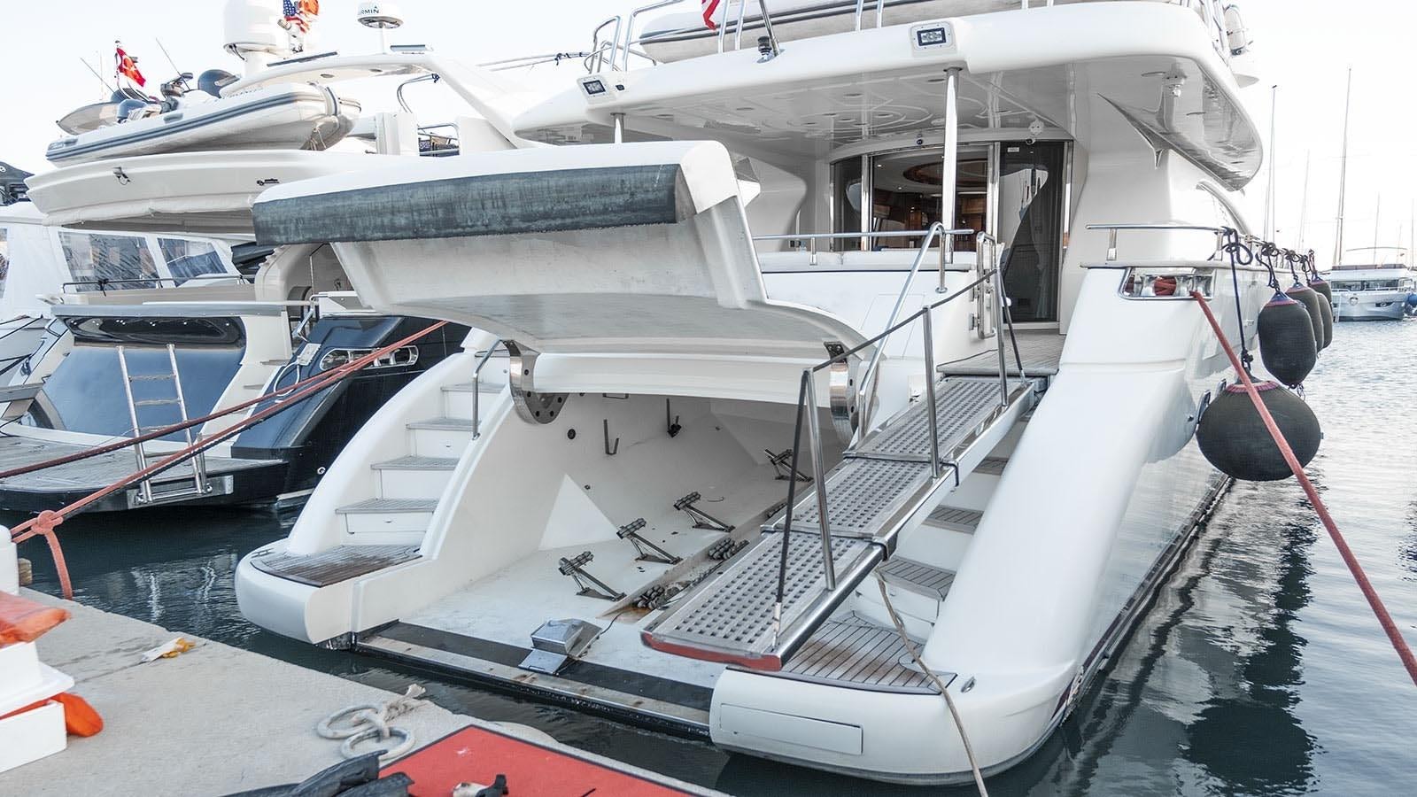 a boat docked at a pier aboard TITAN Yacht for Sale