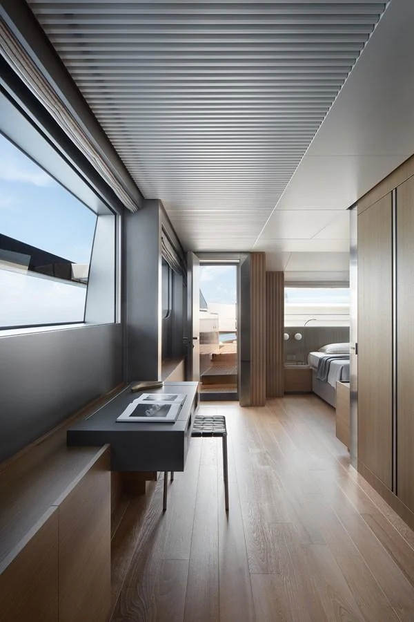 a room with a table and a bed aboard STELLA Yacht for Sale