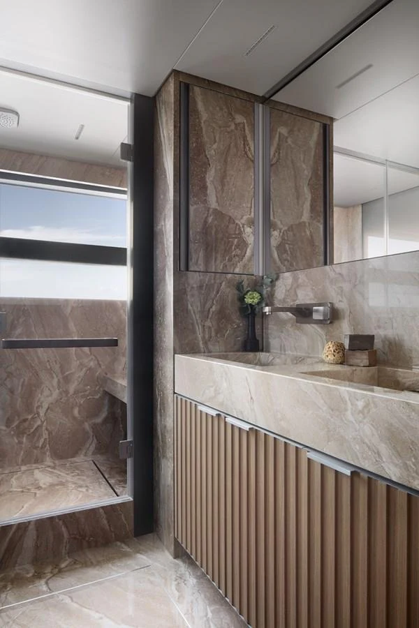 a bathroom with a marble shower aboard STELLA Yacht for Sale