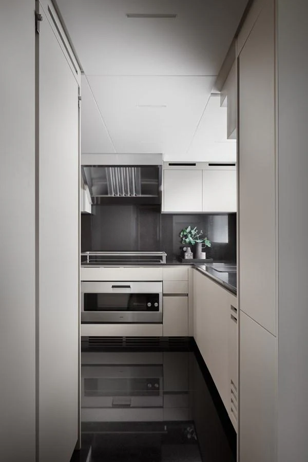 a kitchen with white cabinets aboard STELLA Yacht for Sale
