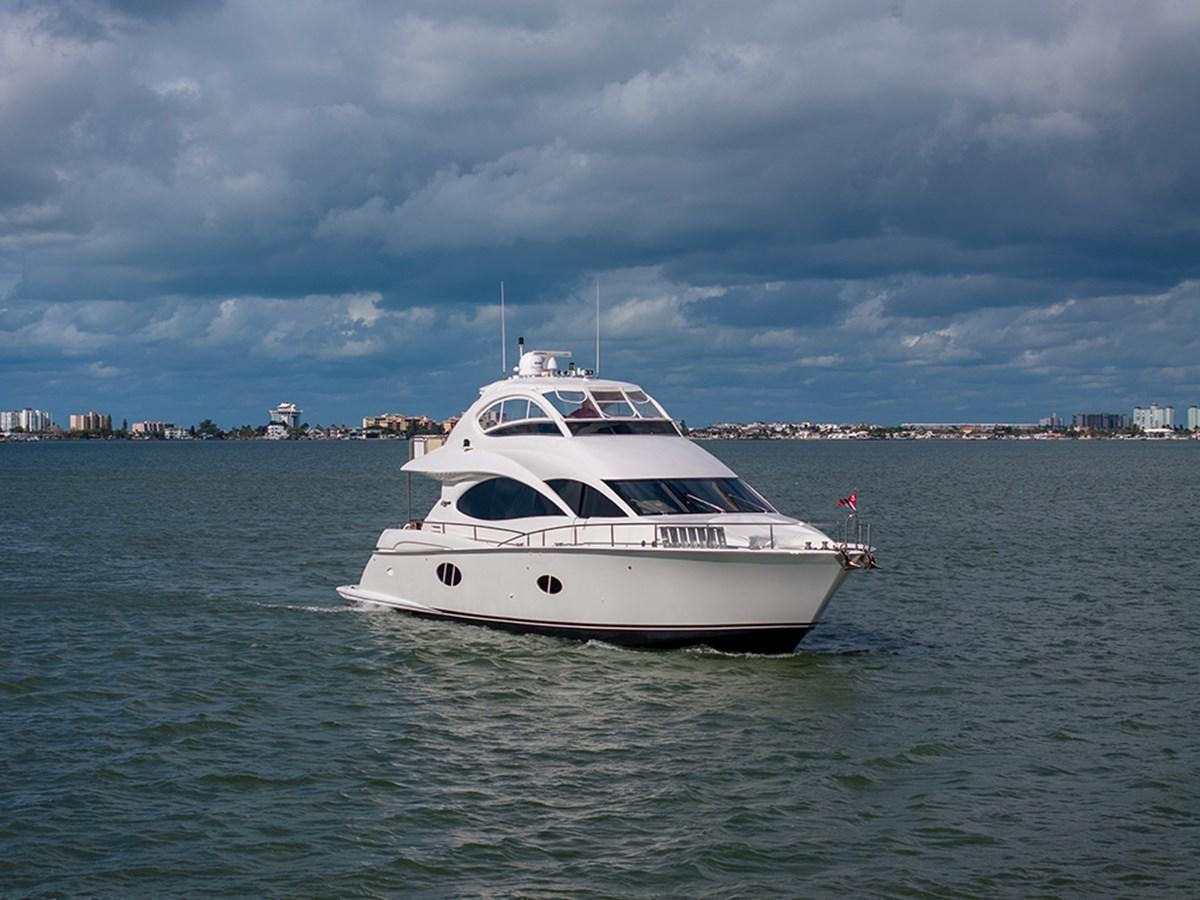a white yacht in the water aboard BODACIOUS VI Yacht for Sale