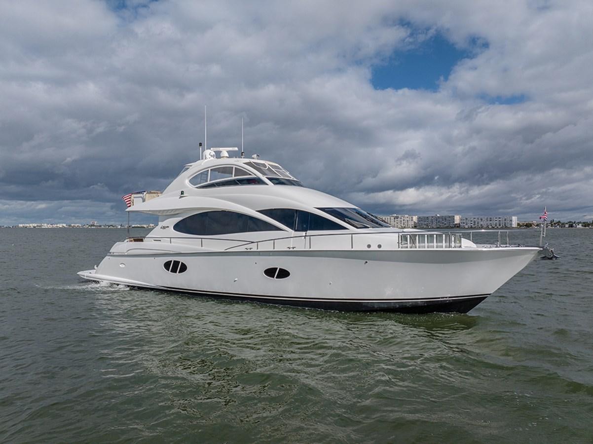 a white yacht in the water aboard BODACIOUS VI Yacht for Sale